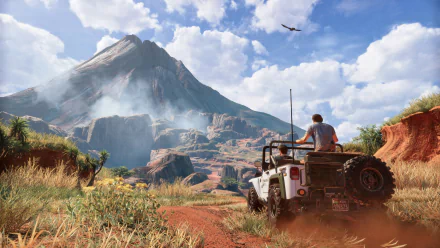 HD desktop wallpaper of Uncharted 4: A Thief's End featuring Nathan and Samuel Drake in a jeep, exploring rugged terrain with a towering mountain and vast sky in the background.