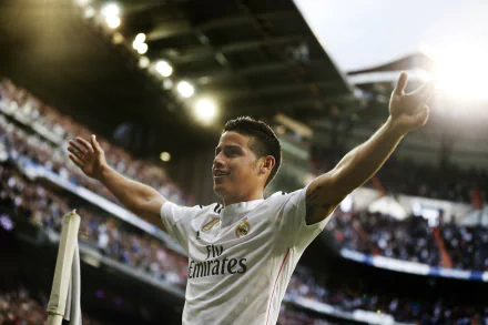 James Rodriguez celebrates on the field while playing for Real Madrid C.F., captured in this dynamic 4K Ultra HD desktop wallpaper. A vibrant moment in sports history.