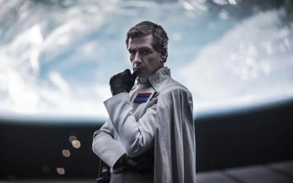 Orson Krennic, portrayed by Ben Mendelsohn, stands with a contemplative expression against a cosmic backdrop in this stunning 4K Ultra HD wallpaper from *Rogue One: A Star Wars Story*.