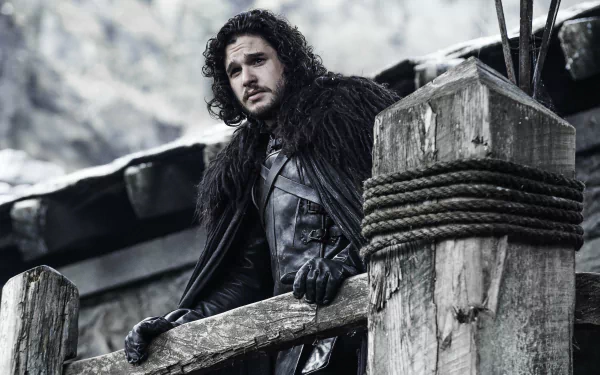 Jon Snow, portrayed by Kit Harington in Game of Thrones, stands on a wooden structure in this 4K Ultra HD PC desktop wallpaper.