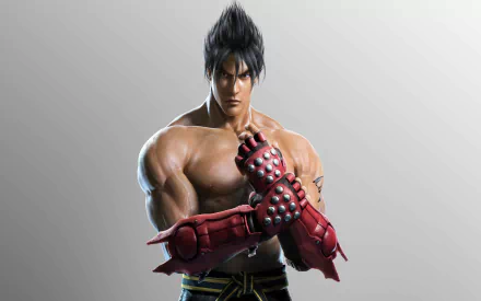 HD desktop wallpaper of Jin Kazama from Tekken 7. The character is featured in a powerful pose with red armored gloves, showcasing his muscular build and intense expression.