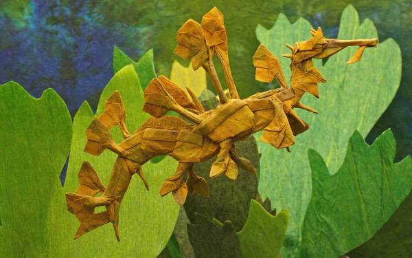 A detailed origami leafy seadragon crafted from brown paper is displayed against a green, aquatic-themed background in this 4K Ultra HD PC desktop wallpaper.