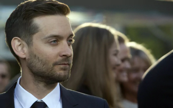 Close-up of American actor Tobey Maguire in a suit at an event, captured as a high-definition PC desktop wallpaper and background.
