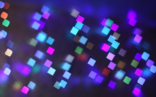 Abstract image featuring a vibrant mix of colors and glittering light, showcasing a soft blur of multicolored squares. This 4K Ultra HD wallpaper creates a mesmerizing backdrop.
