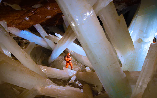 Stunning HD wallpaper of massive crystal formations inside a cave in Mexico, showcasing the natural elemental beauty of the underground world.