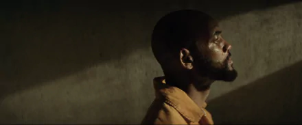 A dramatic HD wallpaper featuring Deadshot from the movie Suicide Squad, showcasing a contemplative Will Smith against a moody, shadowy backdrop.