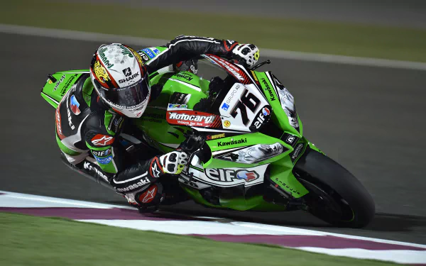 Close-up of a Kawasaki racing motorcycle in vibrant green and black, captured in dynamic motion on the track. A high-resolution 4K Ultra HD sports wallpaper.