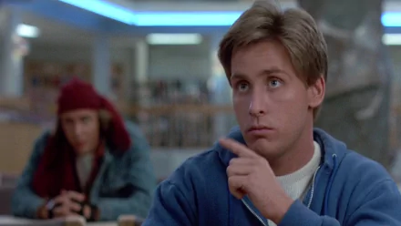 HD desktop wallpaper featuring Judd Nelson as John Bender from the movie The Breakfast Club with Emilio Estevez and Andrew Clarke in the background.