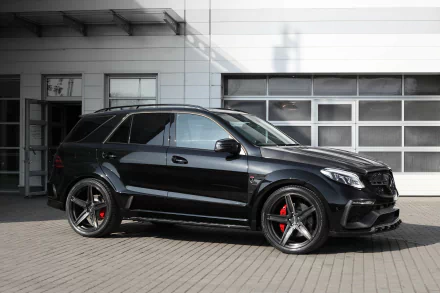Black Mercedes-Benz GL-Class SUV parked in front of a modern building, captured in an HD desktop wallpaper showcasing the vehicle's sleek design.