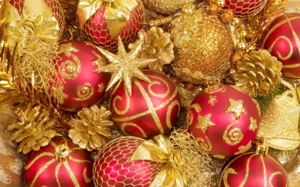 HD desktop wallpaper featuring red and gold Christmas ornaments, golden pine cones, and festive holiday decorations.