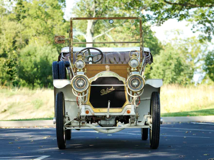 Front view of a cream 1909 Packard Model 18 Touring vintage car on a tree-lined road — HD PC desktop wallpaper