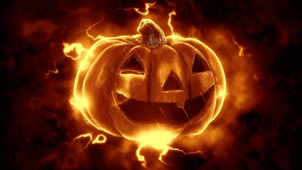 HD Halloween-themed PC wallpaper featuring an evil jack-o'-lantern pumpkin glowing with fiery orange light against a dark, smoky background.