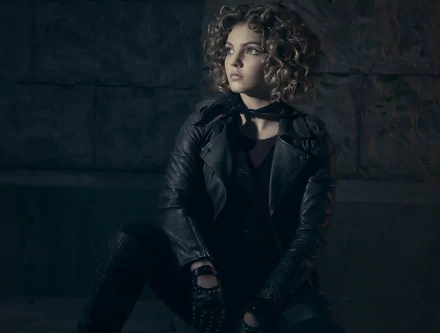 Camren Renee Bicondova as Selina Kyle, also known as Catwoman, poses dramatically in a dark setting from the TV show Gotham. HD wallpaper featuring an iconic character.