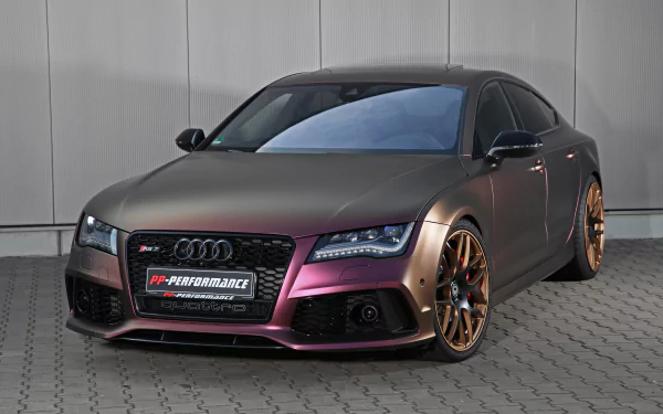 A sleek silver Audi RS7 parked against a neutral backdrop, showcasing its stunning design and bold wheels, presented in a striking 4K Ultra HD format for desktop use.