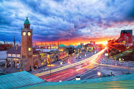 Sunbeam streaks through a time-lapse sunset over Hamburg's iconic architecture and bustling cityscape, showcasing a vibrant man-made urban scene in Germany.