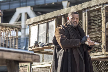 HD desktop wallpaper featuring Laurence Fishburne in a scene from the movie John Wick: Chapter 2, surrounded by gritty, urban scenery.