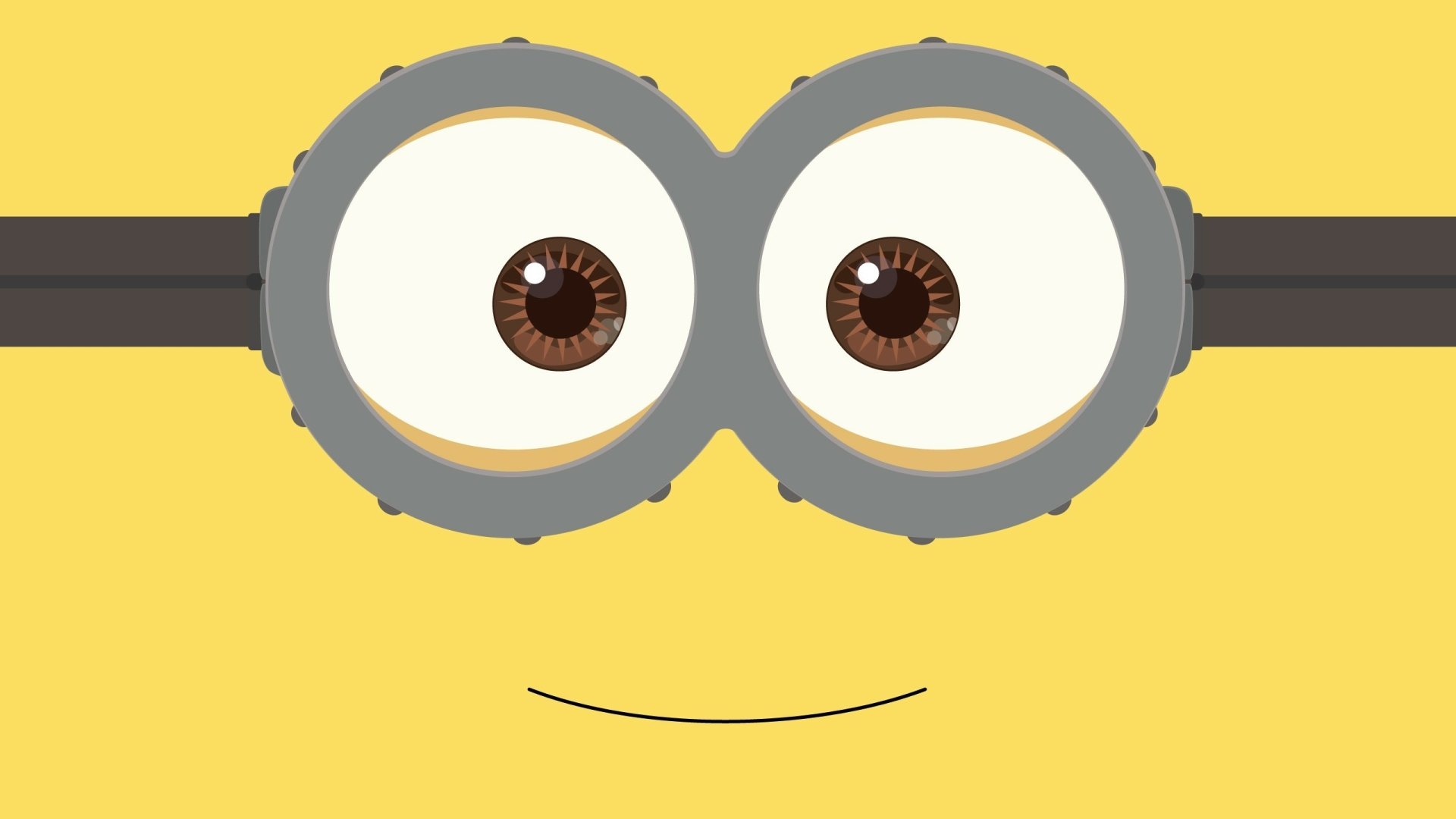 A minimalist HD desktop wallpaper featuring the character Kevin from the Minions movie, depicted with a close-up of his goggles and smile against a yellow background.