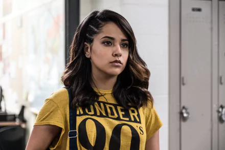 Becky G as Trini Kwan in Power Rangers (2017), showcasing her character's confident and determined demeanor in a school setting, featured as a 4K Ultra HD desktop wallpaper.