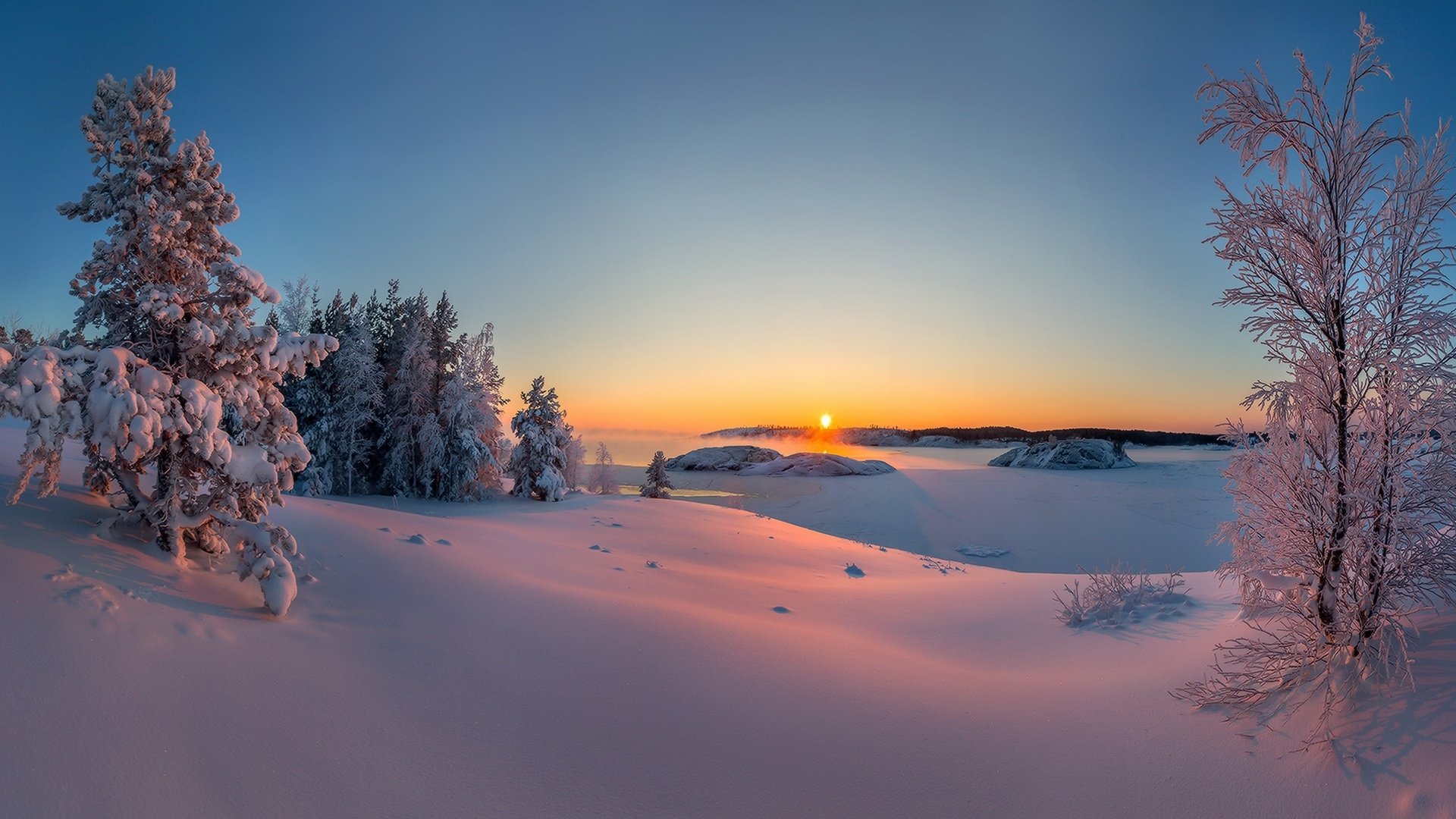 Winter Sunrise: A Stunning HD Wallpaper of Snowy Horizons