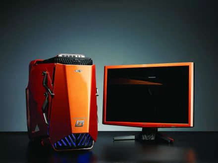 Acer desktop computer with an orange tower and matching monitor, displayed against a dark background as an HD PC desktop wallpaper and technology-themed image.