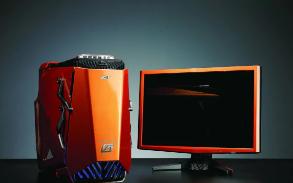 Acer desktop computer with an orange tower and matching monitor, displayed against a dark background as an HD PC desktop wallpaper and technology-themed image.