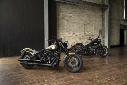 Harley-Davidson Softail Slim S and Softail Slim motorcycles displayed indoors on wooden flooring, featured as an HD PC desktop wallpaper and background.