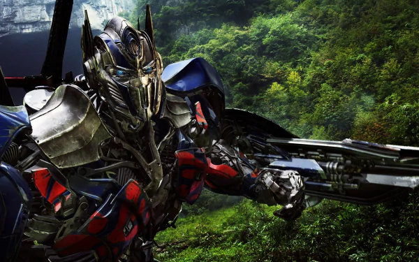 HD wallpaper featuring Optimus Prime from Transformers: Age of Extinction, showcasing the iconic Autobot against a lush, vibrant green background.