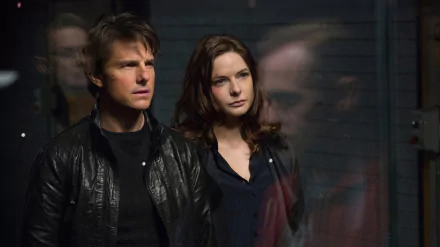 Ethan Hunt and Ilsa Faust, played by Tom Cruise and Rebecca Ferguson, focus intently in this dynamic HD wallpaper from Mission: Impossible - Rogue Nation.
