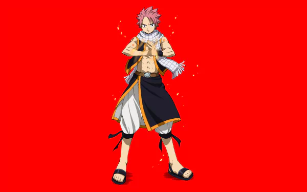 Natsu Dragneel from the anime Fairy Tail stands confidently against a vibrant red background in this 4K Ultra HD PC desktop wallpaper.