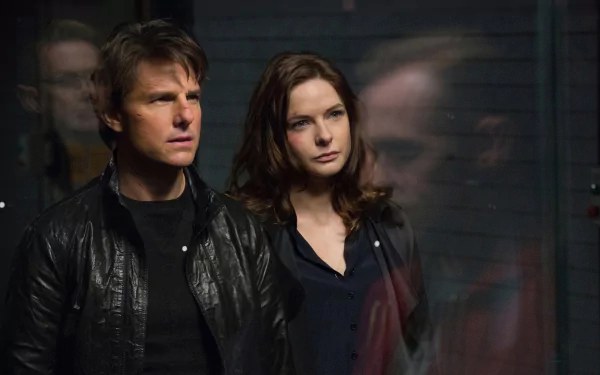 Ethan Hunt and Ilsa Faust, played by Tom Cruise and Rebecca Ferguson, focus intently in this dynamic HD wallpaper from Mission: Impossible - Rogue Nation.