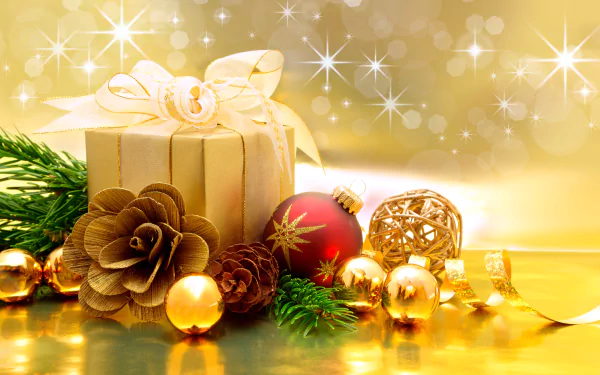 4K Ultra HD holiday desktop wallpaper featuring a glittering gold gift box, pine cones, red Christmas ornaments, and festive greenery against a sparkling golden background.