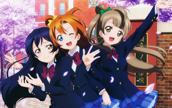 HD desktop wallpaper featuring Umi Sonoda, Honoka Kousaka, and Kotori Minami from the anime Love Live!, posing cheerfully in their school uniforms amid a background of cherry blossoms.
