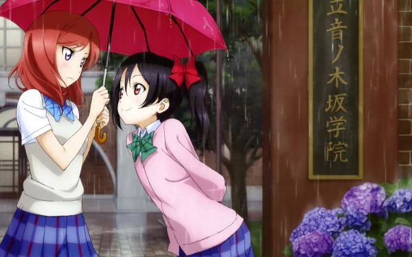 Anime characters Maki Nishikino and Nico Yazawa from Love Live! share an umbrella in the rain, creating a charming HD desktop wallpaper.
