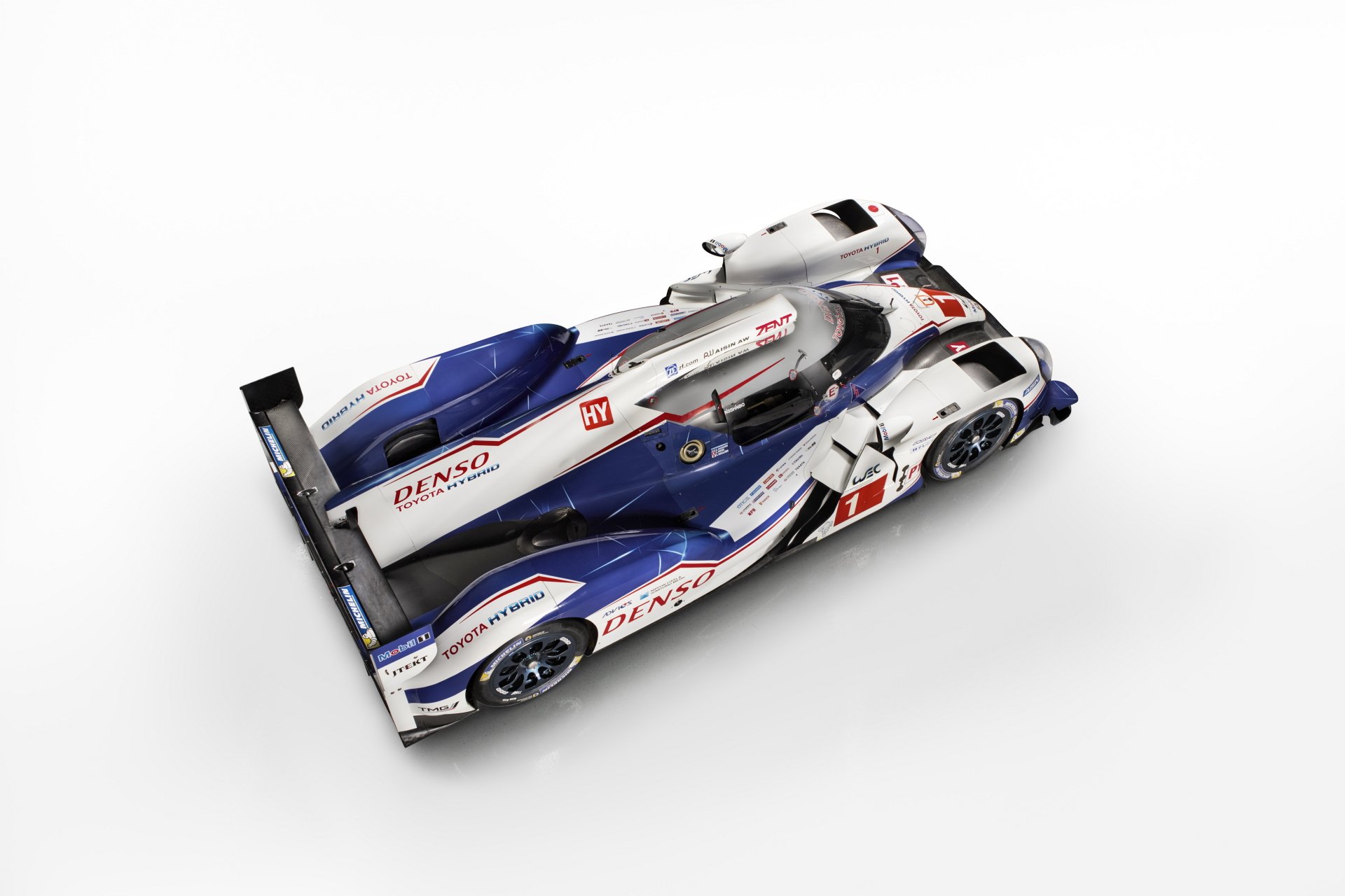 Top-down view of a Toyota TS040 Hybrid race car vehicle on white background, 4K Ultra HD PC desktop wallpaper.