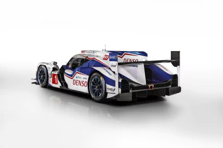 Rear three-quarter view of Toyota TS040 Hybrid Le Mans race car in white, blue and red livery on a clean white backdrop — 4K Ultra HD PC desktop wallpaper