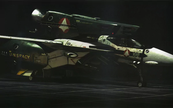 Anime Macross HD PC desktop wallpaper: a pair of cinematic variable fighters on a dimly lit hangar floor, detailed markings and UN SPACY insignia, high-contrast lighting and realistic textures.