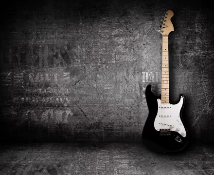 HD desktop wallpaper featuring an electric guitar against a grunge-style textured wall.