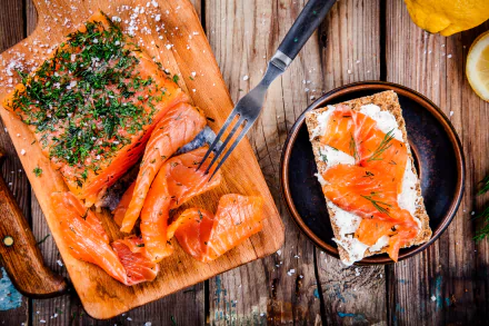 Close-up of smoked salmon on toast with herbs and cream cheese, styled as a still life seafood dish on a wooden board, captured in 4K Ultra HD for desktop wallpaper.
