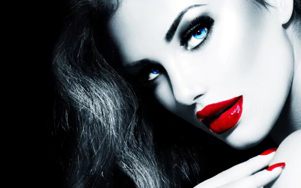 Close-up HD wallpaper of model Anna Subbotina with striking blue eyes, bold red lipstick, and dark flowing hair, showcasing a dramatic and glamorous look.