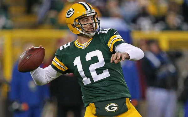 HD wallpaper of a Green Bay Packers quarterback in action, wearing #12, set against a stadium backdrop.
