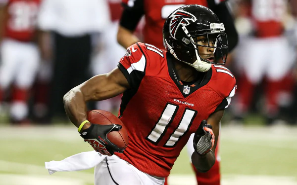 HD desktop wallpaper featuring Julio Jones in a red Falcons jersey running with a football.