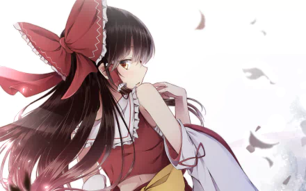 HD anime desktop wallpaper featuring Reimu Hakurei from Touhou, depicted with flowing dark hair, a large red bow, and traditional shrine maiden attire against a soft, airy background.