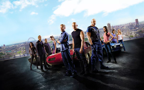 HD desktop wallpaper featuring the cast of Fast & Furious 6 standing confidently in front of cars with a cityscape background.