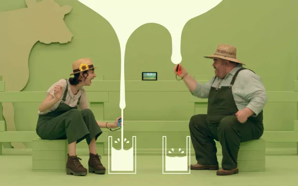 HD desktop wallpaper featuring two players engaged in a 1-2-Switch game, surrounded by a playful green backdrop.