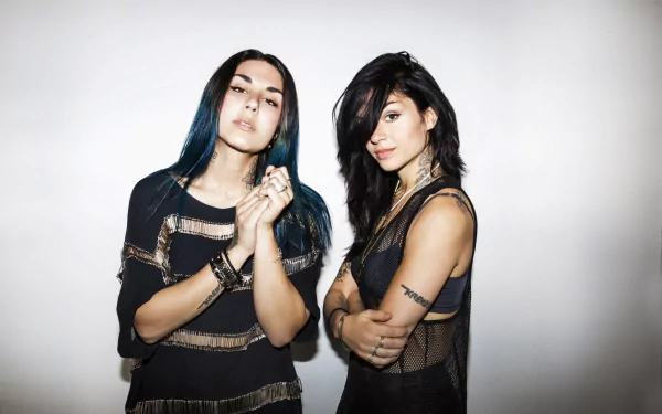 HD PC desktop wallpaper featuring the music duo Krewella posing against a plain white background.