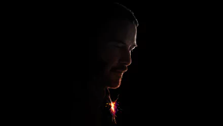 HD desktop wallpaper featuring Keanu Reeves as John Wick from the movie John Wick: Chapter 2 with a dark, dramatic background.