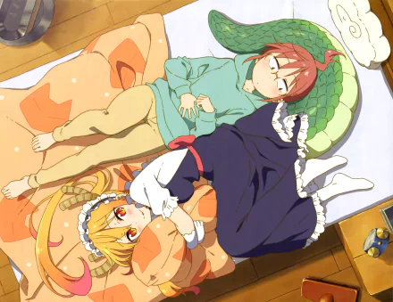 HD wallpaper featuring Kobayashi and Tohru from Miss Kobayashi's Dragon Maid. The anime characters are resting together on a bed, highlighting a cozy and serene scene.