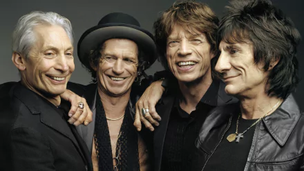 HD desktop wallpaper featuring The Rolling Stones members smiling together, highlighting their iconic presence in music.