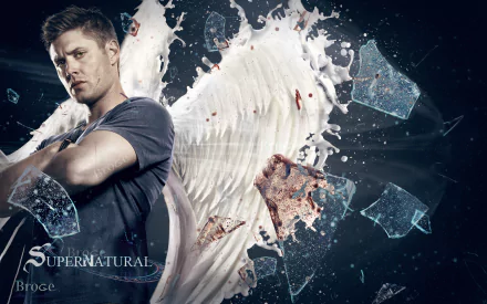 A striking HD wallpaper featuring Jensen Ackles as Dean Winchester from the TV show Supernatural, showcasing a dramatic background with angel wings and shattered glass effects.