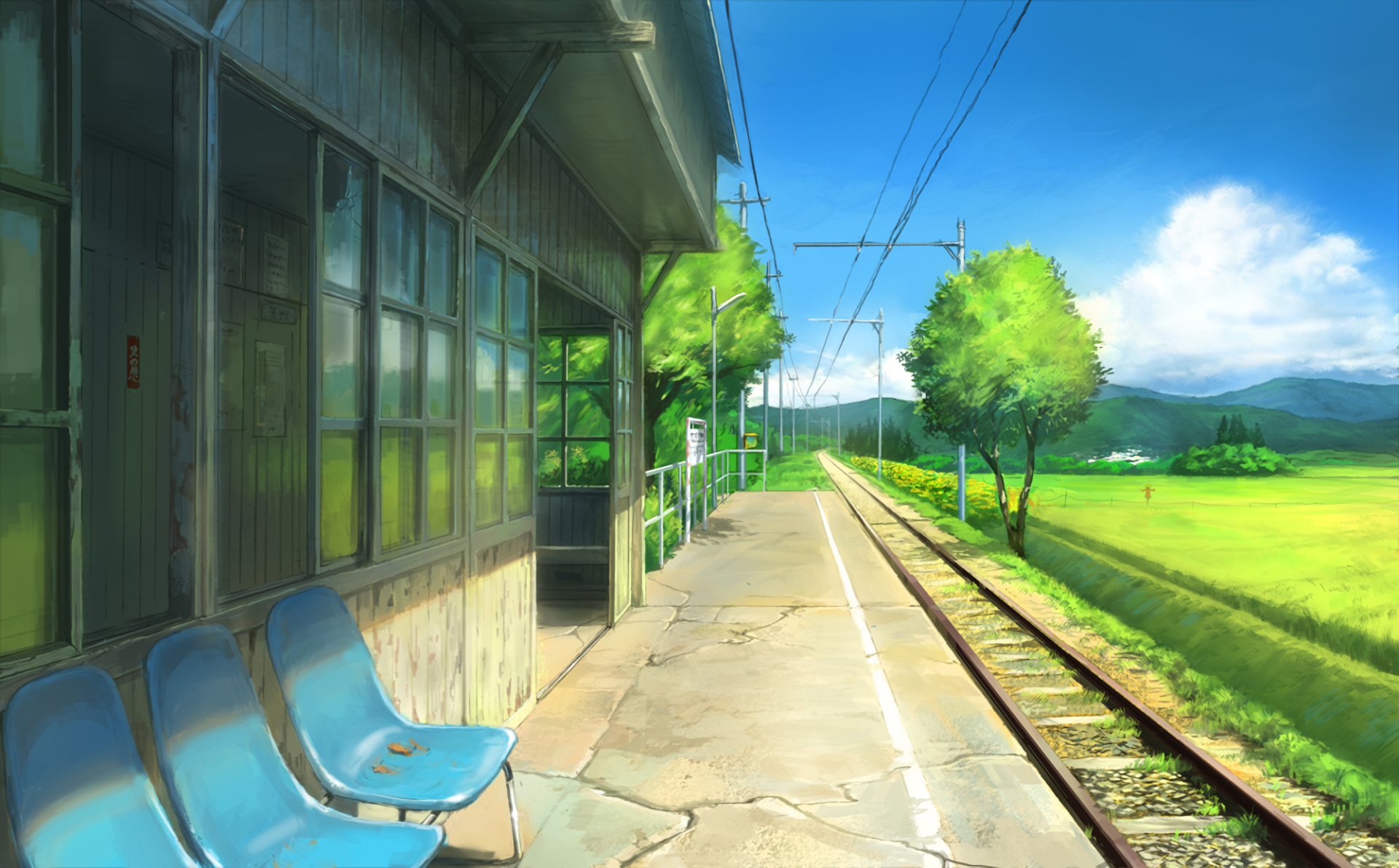 HD anime background depicting an empty train station in a serene, rural setting. Lush green fields and blue skies enhance the tranquil atmosphere.